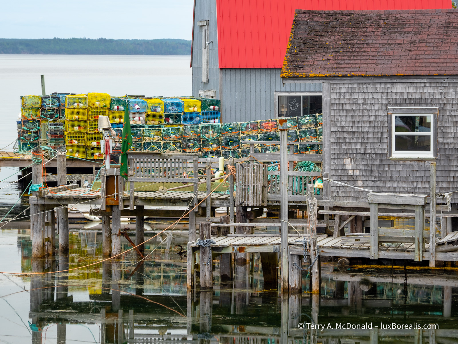 Traps ‘n’ Docks ‘n’ Lines
A close up of fishing whafs and huts with stacks of colourful lobster traps and many different ropes and lines.